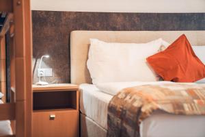 Łóżko lub łóżka w pokoju w obiekcie Ferienwohnung Nassfeld