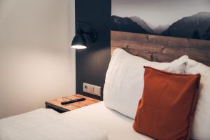 Łóżko lub łóżka w pokoju w obiekcie Ferienwohnung Nassfeld