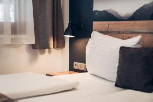 Łóżko lub łóżka w pokoju w obiekcie Ferienwohnung Nassfeld