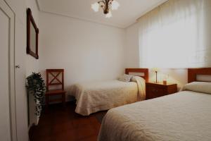 Tempat tidur dalam kamar di El Mirador de San Vicente