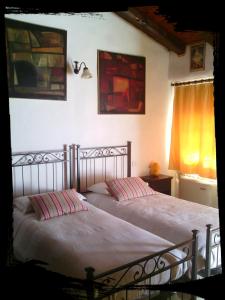 Voodi või voodid majutusasutuse Albergo Julienne toas
