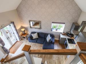 an overhead view of a living room with a blue couch at The Stables in Scarborough