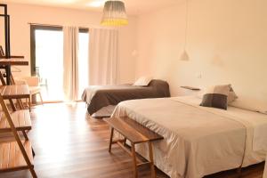 Postel nebo postele na pokoji v ubytování Villa Mendotza + 37 fotografií