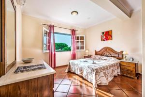Cama o camas de una habitación en Villa Bitoque 27 fotos más