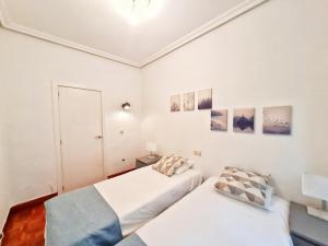 Posteľ alebo postele v izbe v ubytovaní Apartamento Urbieta by SanSe Holidays - Center