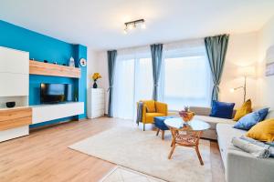 a living room with a couch and a table at Feel Home DeLuxe CORVIN # FREE PARKING # AC # Elevator in Budapest