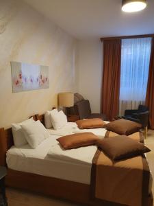 a hotel room with two beds and a window at Apartment B026 - Aparthotel Vučko in Jahorina