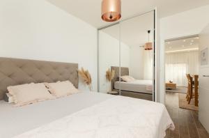 Postel nebo postele na pokoji v ubytování Apartmani Pravilovic II