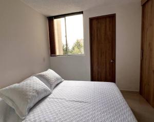 Letto o letti in una camera di Apartamento tranquilo, nuevo y central