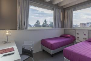 Postel nebo postele na pokoji v ubytování Hotel Doge