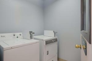 a white washer and dryer in a room at SureStay Hotel by Best Western Wells in Wells +20 photos