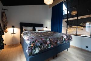 Postel nebo postele na pokoji v ubytování Broncks Lonin - Luxury Apartments in the Heart of Tórshavn