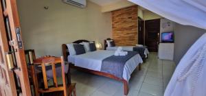 Uma cama ou camas num quarto em Hotel Pousada Sol & Lua