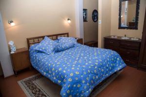 Ένα ή περισσότερα κρεβάτια σε δωμάτιο στο Comfortable & Sunny House in La Paz