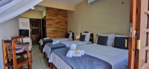 Uma cama ou camas num quarto em Hotel Pousada Sol & Lua
