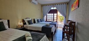 Uma cama ou camas num quarto em Hotel Pousada Sol & Lua