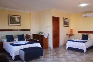 Voodi või voodid majutusasutuse Hostal Romy toas