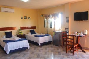 Voodi või voodid majutusasutuse Hostal Romy toas