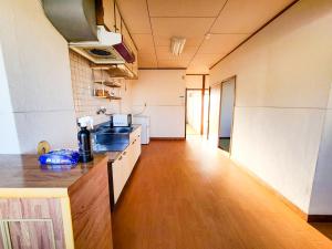 Una cocina o cocineta en Weekly Hotel Kokura