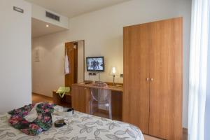 Postel nebo postele na pokoji v ubytování Hotel Doge