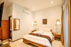 Ein Bett oder Betten in einem Zimmer der Unterkunft Rumah Mertua Heritage