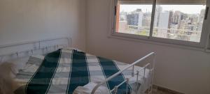 a hospital bed in a room with a window at TORRE Rivera in Buenos Aires +28 photos