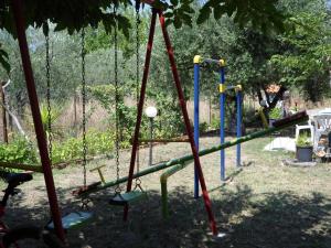 a group of swings in a park at Bozelia Apartments in Toroni