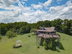 an aerial view of a house in a field at Bells With a View in Sevierville