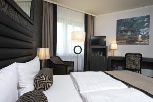 Postel nebo postele na pokoji v ubytování Park Hotel am Berliner Tor
