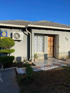 a small house with a fan in front of it at Are you travelling to Pretoria? in Pretoria