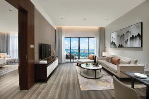 Letto o letti in una camera di Oakwood Residence Foshan