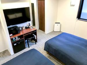 Postel nebo postele na pokoji v ubytování HOTEL LiVEMAX Chiba Soga-Ekimae + 16 fotografií
