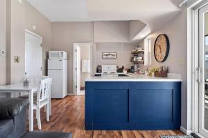 a kitchen with a blue island in a room at Unique Barn Stay Close to The Hills in Rapid City