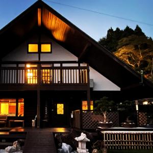 a building with a light on the front of it at 絶景を眼下に見渡す 天空のお宿 雅館 in Ichinoseki