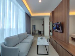 TV a/nebo společenská místnost v ubytování UNHAS HOTEL & CONVENTION