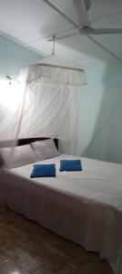 Letto o letti in una camera di Sigiri Lion Lodge