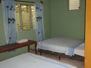 Cama o camas de una habitación en Guest house Posada Ixchel