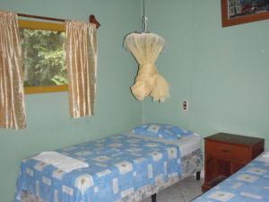 Säng eller sängar i ett rum på Guest house Posada Ixchel