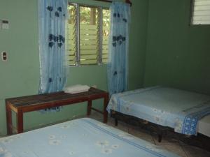 Cama o camas de una habitación en Guest house Posada Ixchel