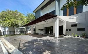 an empty courtyard in front of a building at Bunga Raya Villa By Malvacae Homestays Shah Alam in Shah Alam