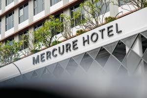 a sign at the entrance to a morgue hotel at Mercure Singapore Tyrwhitt in Singapore