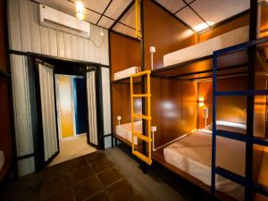 a bunk bed room with two bunk beds in it at Lost & Found Hostel Weligama in Weligama