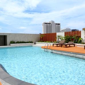 a swimming pool on the roof of a building at Siam View Hotel and Residence in Pattaya Central