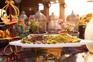 a table topped with a tray of plants and flowers at Amritara Manak Haveli, Jodhpur in Jodhpur
