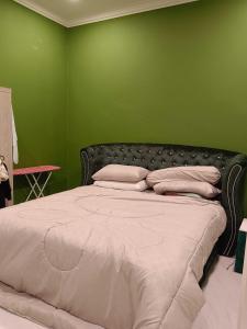 Katil atau katil-katil dalam bilik di OYO Homes 90608 Kampung Sungai R&R,Homestay And Ecofarm