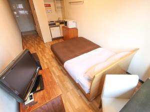TV a/nebo společenská místnost v ubytování HOTEL LiVEMAX BUDGET Kawasaki Ekimae