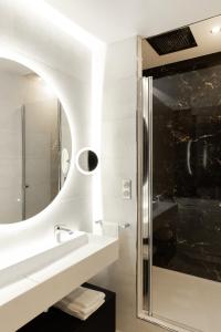 a bathroom with a sink and a mirror at Suite Romanée 6 personnes vue Cathédrale 2 Places de parking in Dijon