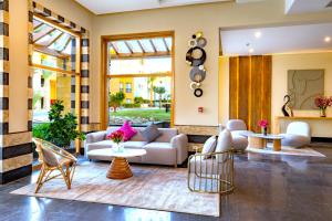 a living room with a couch and chairs at Zen Resort Sahl Hasheesh by TBH Hotels in Hurghada