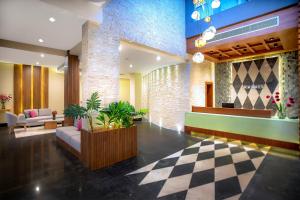 a lobby with a waiting area with a checkered floor at Zen Resort Sahl Hasheesh by TBH Hotels in Hurghada
