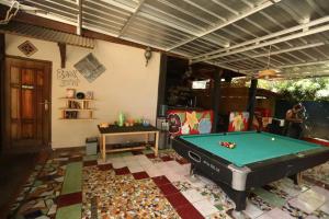 a pool table in the middle of a room at C Point Krui in Krui